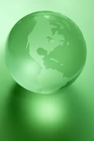 A glass globe on a green ground, representing environmentally benign chemistry